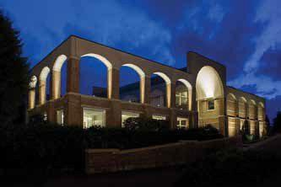 Illuminated architectural arches at night